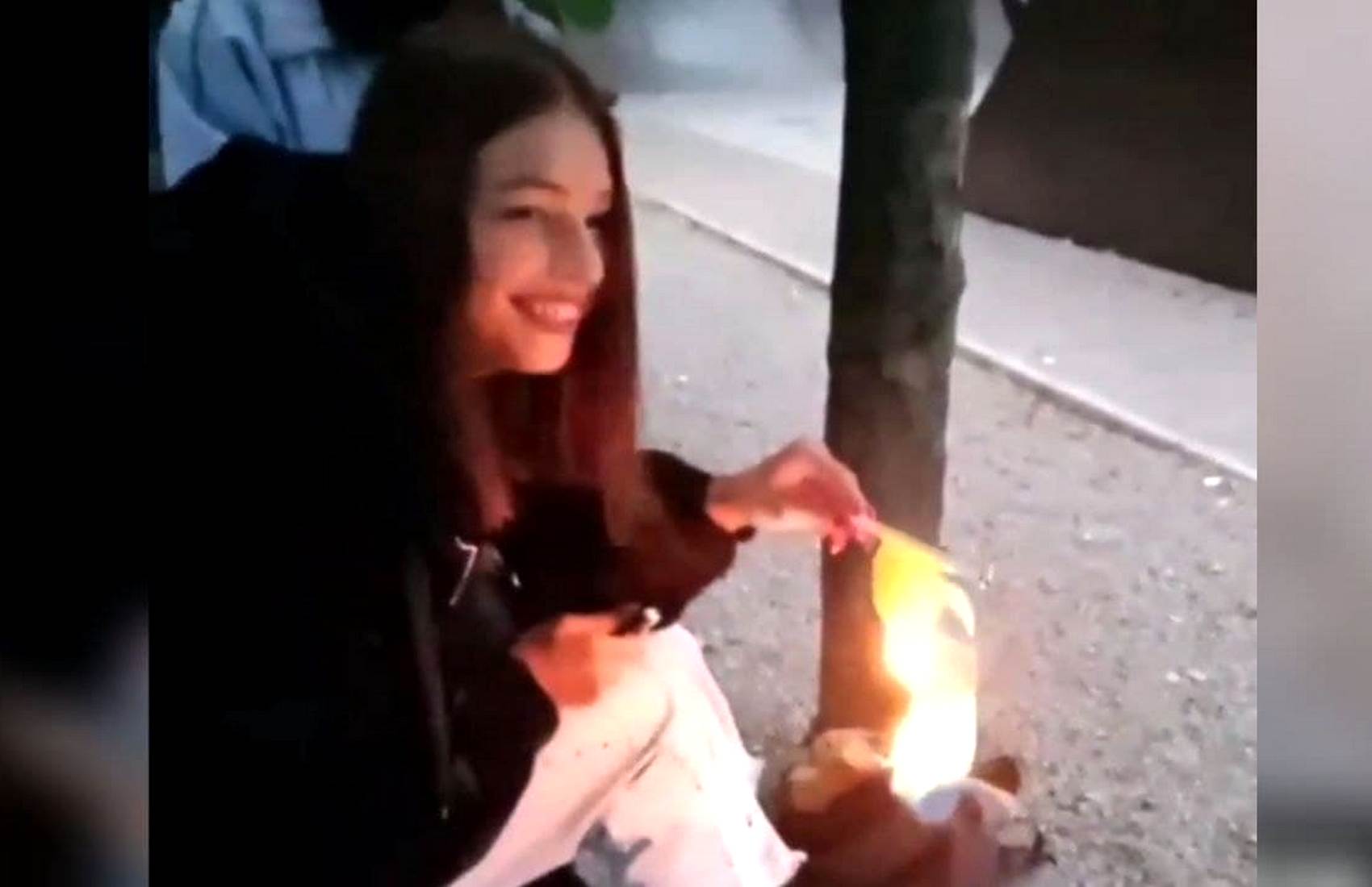 «Это не мой флаг»: в Каменском девушка сожгла украинский флаг (видео)